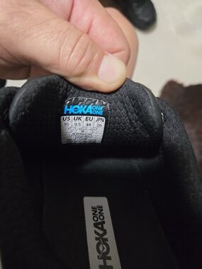 Hoka One One Black Sneaker with Blue Logo Accent